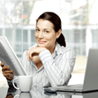 Woman w/ Coffee and Laptop